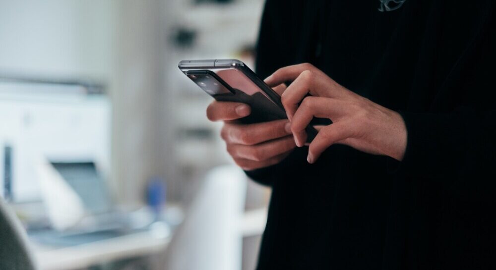 person holding black android smartphone